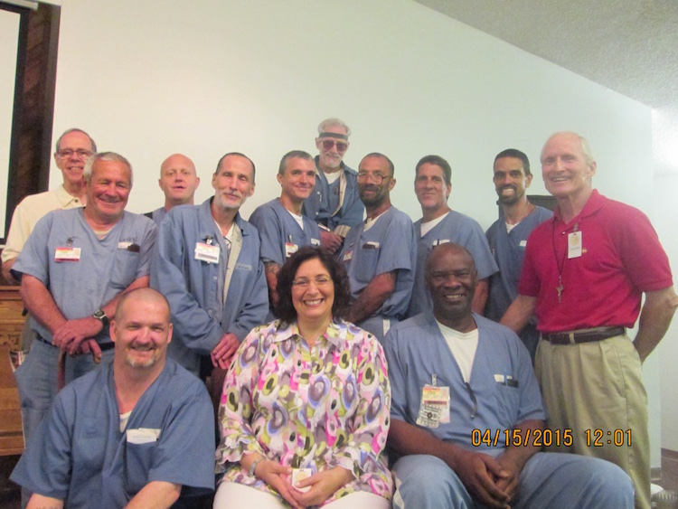 Group picture of inmates and prison staff.